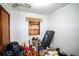 Small bedroom with a built-in shelf and lots of clutter at 1329 Mount Pisgah Rd, Fort Meade, FL 33841