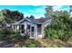 Brick house with overgrown landscaping at 1329 Mount Pisgah Rd, Fort Meade, FL 33841