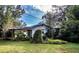 Ranch-style home with carport and overgrown yard at 1329 Mount Pisgah Rd, Fort Meade, FL 33841