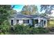 Brick house with overgrown landscaping at 1329 Mount Pisgah Rd, Fort Meade, FL 33841