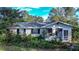 Brick house with overgrown landscaping, needs TLC at 1329 Mount Pisgah Rd, Fort Meade, FL 33841