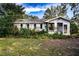 Brick house with overgrown landscaping, needs TLC at 1329 Mount Pisgah Rd, Fort Meade, FL 33841