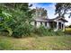 Brick house with overgrown landscaping at 1329 Mount Pisgah Rd, Fort Meade, FL 33841