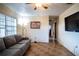 Living room with couch and access to hallway at 1329 Mount Pisgah Rd, Fort Meade, FL 33841