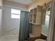 Bright bathroom featuring a tub, vanity, and storage at 137 Harbor Way, Auburndale, FL 33823