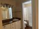 Clean bathroom with single sink vanity and shower/tub combo at 137 Harbor Way, Auburndale, FL 33823