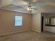 Spacious bedroom with ceiling fan and neutral decor at 137 Harbor Way, Auburndale, FL 33823