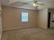 Large bedroom with ceiling fan and neutral carpeting at 137 Harbor Way, Auburndale, FL 33823