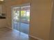 Kitchen dining area with sliding glass doors leading to a screened porch at 137 Harbor Way, Auburndale, FL 33823