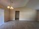 Dining area with tile floor and a chandelier at 137 Harbor Way, Auburndale, FL 33823