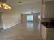 Living room with tile floors and kitchen view at 137 Harbor Way, Auburndale, FL 33823