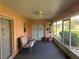 Relaxing screened porch with ceiling fan and room for seating at 137 Harbor Way, Auburndale, FL 33823