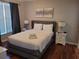 Bright bedroom with a comfortable bed and gray headboard at 1371 Tuscan Ter # 3403, Davenport, FL 33896