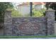 Tuscana condo community entrance with stone pillars and signage at 1371 Tuscan Ter # 3403, Davenport, FL 33896