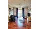 Living room with dark gray sofa, wood floors, and balcony access at 1371 Tuscan Ter # 3403, Davenport, FL 33896