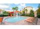 Community splash pad with mushroom fountain and lounge chairs at 1371 Tuscan Ter # 3403, Davenport, FL 33896