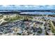 Aerial view of house and neighborhood, highlighting the property's location near water at 1548 Normandy Heights Blvd, Winter Haven, FL 33880