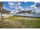 Spacious backyard with a covered patio and a white vinyl fence at 1548 Normandy Heights Blvd, Winter Haven, FL 33880