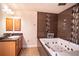 Primary bathroom with a large jacuzzi tub and double vanity at 1548 Normandy Heights Blvd, Winter Haven, FL 33880