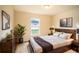 Cozy bedroom with a king-size bed, dresser, and large window at 1548 Normandy Heights Blvd, Winter Haven, FL 33880