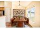 Dining area with large window and rustic wooden table at 1548 Normandy Heights Blvd, Winter Haven, FL 33880