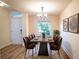 Modern farmhouse dining room with metal table and brown velvet chairs at 1548 Normandy Heights Blvd, Winter Haven, FL 33880