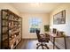 Bright home office featuring built-in shelving and a large window at 1548 Normandy Heights Blvd, Winter Haven, FL 33880
