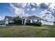 House front view with landscaping and a two-car garage at 1548 Normandy Heights Blvd, Winter Haven, FL 33880
