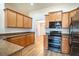 Stainless steel appliances and wood cabinets in kitchen at 1548 Normandy Heights Blvd, Winter Haven, FL 33880
