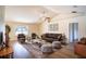 Relaxing living room featuring brown leather seating and a large area rug at 1548 Normandy Heights Blvd, Winter Haven, FL 33880