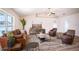 Spacious living room with leather sofas and a large flat-screen TV at 1548 Normandy Heights Blvd, Winter Haven, FL 33880
