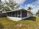 House with a large backyard and screened patio at 162 N 2Nd St, Eagle Lake, FL 33839