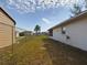 Large backyard with chain link fence and detached storage shed at 162 N 2Nd St, Eagle Lake, FL 33839