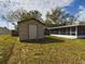 Large backyard with shed and screened patio at 162 N 2Nd St, Eagle Lake, FL 33839