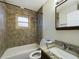 Bathroom with shower/tub combo and granite vanity at 162 N 2Nd St, Eagle Lake, FL 33839