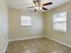 Bedroom with tile floors and ceiling fan at 162 N 2Nd St, Eagle Lake, FL 33839