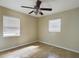 Spacious bedroom with tile floors and ceiling fan at 162 N 2Nd St, Eagle Lake, FL 33839