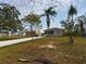 House with a long driveway, a large backyard and a detached shed at 162 N 2Nd St, Eagle Lake, FL 33839