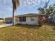 One-story house with a spacious front yard and mature landscaping at 162 N 2Nd St, Eagle Lake, FL 33839