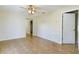 Bright and airy living room with tile floors and a ceiling fan at 162 N 2Nd St, Eagle Lake, FL 33839
