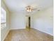 Spacious living room with tile flooring and ceiling fan at 162 N 2Nd St, Eagle Lake, FL 33839