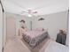 Bedroom with a double bed, dresser, and ceiling fan at 1716 Quail Hill Dr, Lakeland, FL 33810