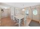 Bright dining area with table and chairs, and view into kitchen at 1716 Quail Hill Dr, Lakeland, FL 33810