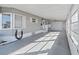 Enclosed patio with garage access and ceiling fan at 1716 Quail Hill Dr, Lakeland, FL 33810