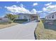 Single-wide manufactured home with carport and landscaped yard at 1716 Quail Hill Dr, Lakeland, FL 33810