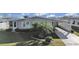 Single-wide manufactured home with carport and landscaped yard at 1716 Quail Hill Dr, Lakeland, FL 33810