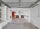 Spacious garage with workshop and ample storage shelving at 1716 Quail Hill Dr, Lakeland, FL 33810