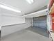 Garage with overhead storage and water heater at 1716 Quail Hill Dr, Lakeland, FL 33810