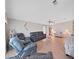Spacious living room with ample seating and hardwood floors at 1716 Quail Hill Dr, Lakeland, FL 33810