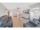 Bright living room, hardwood floors, and view into kitchen at 1716 Quail Hill Dr, Lakeland, FL 33810